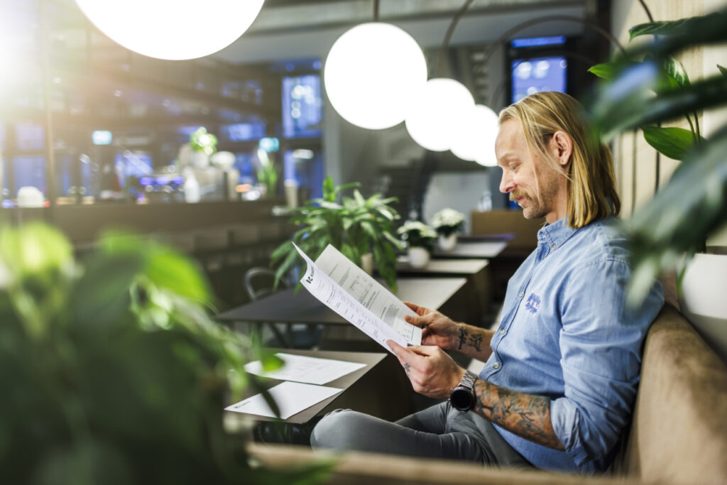 man reading papers